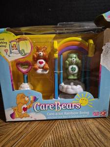 lot 50 image: Care Bears Care-a-lot Rainbow Swing Playset