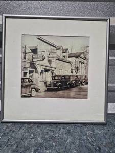 lot 62 image: Framed Historical Main Street Photograph with Classic Cars