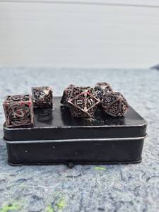 lot 128 image: Dragon Design Polyhedral Dice Set with Metal Storage Tin