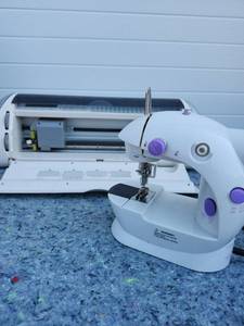 lot 285 image: CRICUT AND Portable Electric Sewing Machine with Purple Accents - NOT TESTED