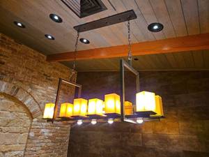 lot 21510 image: Industrial Linear Chandelier with Amber Glass Shades