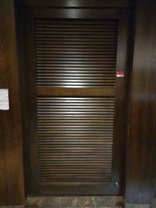 lot 21665 image: Wood Louvered Closet Door Left Hinge