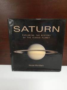 lot 2098 image: Saturn Exploring the Mystery of the Ringed Planet by Nicole Mortillaro