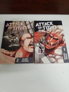 lot 2171 image: Attack on Titan Manga Volumes 1 and 2 by Hajime Isayama