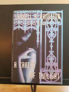 lot 2302 image: A Caress of Twilight by Laurell K. Hamilton
