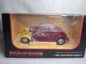 lot 1513 image: 1934 Ford Coupe Die-Cast Metal Car Model with Flame Graphics