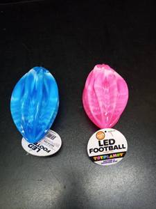 lot 1021 image: Set of 3 - LED Light-Up Football Fidget Toys Set Blue, Orange and Pink - Retail $22