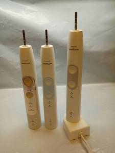 lot 1057 image: (3) Philips Sonicare Electric Toothbrush Bundle with Charging Base.  No Cases.  - Retail $25