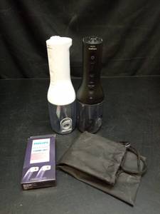 lot 1096 image: (2) Philips Sonicare Waterpick  Set with Replacement Nozzles and Travel Bag - Retail $45