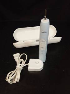 lot 1131 image: Philips Sonicare Electric Toothbrush with Travel Case and Charger - Retail $25