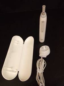 lot 1132 image: Oral-B iO Electric Toothbrush with Travel Case and Charger - Retail $85