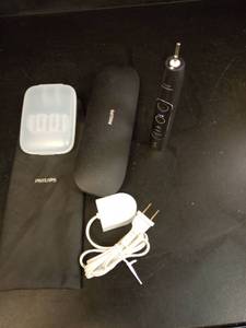 lot 1133 image: Philips Sonicare Electric Toothbrush with Charger and Travel Case - Retail $45