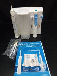 lot 1092 image: Oral-B 2 in 1 Professional Dental Center Electric Toothbrush and Water Flosser - Retail $80