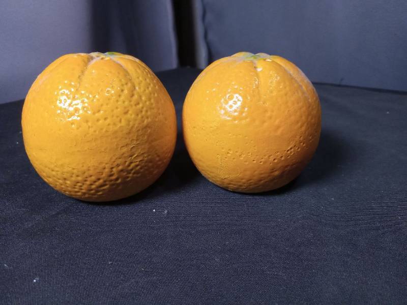 lot 40820 image: Ceramic Orange Salt and Pepper Shakers with Faces