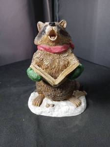 lot 40957 image: Tim Wolfe Sculpture Raccoon Jesse Reading Book Figurine