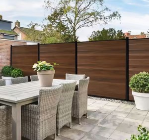 lot 51 image: 6 ft. x 6 ft. Board on Board Flat Framed Woodgrain Horizontal Hickory Vinyl Fence Boards (12-Pack) Retails $106