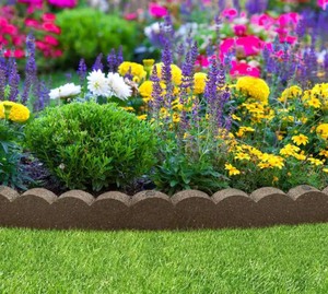 lot 108 image: Bundle of 2 Pieces - 47 in. x 2 in. x 4 in. Brown Scalloped Rubber Garden Edging