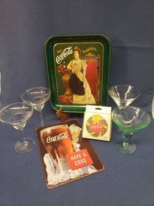 lot 9 image: 1977 75th Anniversary Coca-Cola Tray - 11in W x 13in T, NIP Coca Cola Nature Stone Coasters, Metal Coke Advertizing Sign 8in W x 12in T, and 4 Cocktail Glasses