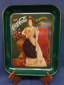 lot 9 image: 1977 75th Anniversary Coca-Cola Tray - 11in W x 13in T, NIP Coca Cola Nature Stone Coasters, Metal Coke Advertizing Sign 8in W x 12in T, and 4 Cocktail Glasses