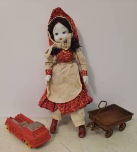 lot 46 image: Antique Auburn Rubber Co. Fire Truck -  Stamped #3 -  Made in USA, Antique Hand Painted Porecelain Doll 9.5in T, and Metal Mini Wagon