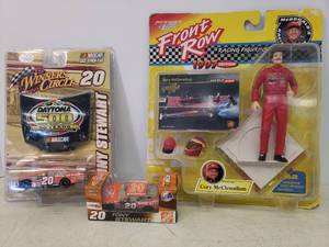 lot 47 image: 1997 Front Row Johnny Lightening - Cory McClenathan Figurine - in Original Unopened Blister Pack, NASCAR Joe Gibbs Racing #20 Tony Stewart 164 Scale Die-Cast Stock Car in Original Box, & Winners Circle Daytona 500 in Original unopened Blister Pack