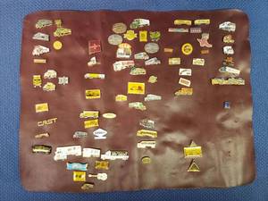 lot 58 image: Lot of 75 Vintage Trucking Pins - Various Companies - Include Pin Backs - on Vinyl Display Mat
