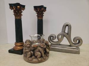 lot 73 image: Resin Happy Monkeys Votive HolderStand, Heavy Metal A Boodkend, and Pair of Corinthian Column Candlesticks - 9.25in T