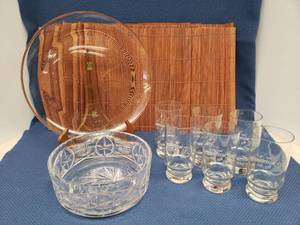 lot 82 image: Set of 6 Commemorative High Ball Glasses for Hesston Equipment Company 25th Anniversary, Large Heavy Cut Lead Crystal Console Bowl 8.25in W x 3in T, Round Glass Serving Tray 13in W, and Set of  8 Bamboo Placemats
