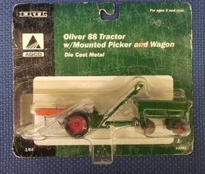 lot 94 image: 2000 ERTL 164 Scale AGCO Die-Cast Oliver 88 Tractor with Mounted Picker and Wagon - #13051 - Unopened in Original Blister Package.