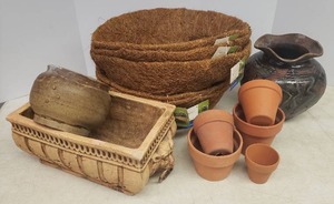 lot 99 image: Vintage Signed RAKU Pottery Planter 8.25in W x 8.25in T, Signed Thrown Pottery Planter, 5 NewUnused Coconut Husk Hanging Planter Liners, 5 Terra Cotta Planters largest is 4.5iin W x 3.5in T, Lion Head Cement Planter - Chipped - 13in L x 7in W x 5.5in T