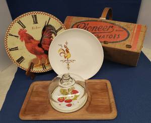 lot 108 image: Vintage Pioneer Brand 8QT Tomato Basket with Wooden Handle 16in L x 8.5in W x 10in T, Red Rooster BO Wall Clock 11.5in W, Good Wood Teak Charcuterie Tray with Glass Dome 15in L x 8in W x 6in T & Salem Pottery Cock O the Walk 10in Dinner Plate