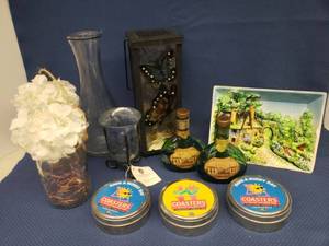 lot 111 image: Deck Patio BO Lanterns - Butterfly 10.5in T, Floral Jar Lamps 8in T, Wine Caraffe, 3 New Sets of Coasters, Vintage Mateus Green Glass Rose Wine Bottles, Blown Glass Candle Holder 5.25in T, Vintage 3D Majolica Relief Wall Art - 8.25in W x 6.5in T