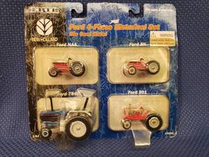lot 119 image: Vintage 2003 ERTLRC2 Brands - New Holland - Ford 4-Piece Historical Set - Die-Cast Metal Tractors - 164 Scale - in Original Unopened Package