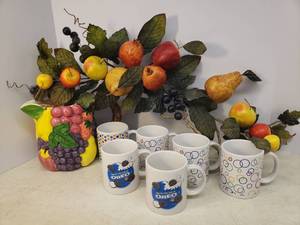 lot 134 image: Vintage Pier I Ceramic Fruit Pitcher 7in T, New Old Stock Gift Mugs including 2 OREO, and Faux Fruit GarlandSwag
