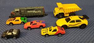 lot 153 image: Vintage Die-Cast Toy Cars & Train MAISTO Yellow Dump Truck, 3 Mini Racers, 1994 Hot Wheels Taxi, 1988 Micro Machines Pontiac Firebird, and Southern Pacific 9725 High Speed #418 Train Engine