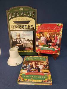 lot 162 image: Traeger Stoneware Grill Chicken Cooking Stand with Instructions on Bottom,  BBQ Cookbook, 2 Pioneer Woman Cooks Dinnertime & Come and Get It Cookbooks, and Blueplate Special Chalkboard Wall Plaque
