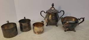 lot 170 image: Vintage Silver Plate Childrens Mugs - 2 with NameInitial - All Bottom Stamped, Sheridan Silverplate Footed Sugar Bowl with Lid and Footed Creamer