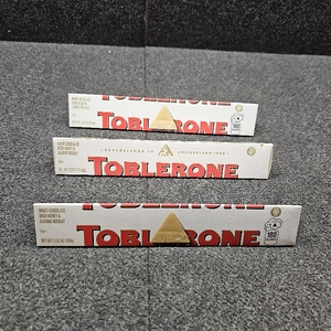 lot 466 image: Lot of 3, TOBLERONE White Chocolate Bar with Honey and Almond Nougat, Bulk Chocolate, 3.52 oz Bars BB Jan 17,2026