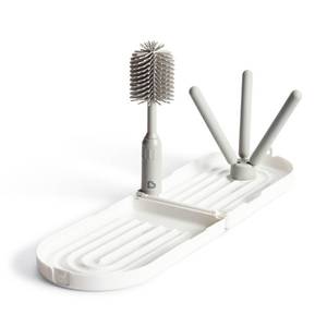 lot 6054 image: Munchkin� Travel Baby Bottle Drying Rack with Silicone Bottle Brush - Compact and Foldable, Fits Easily in Diaper Bags for On-the-Go Use
