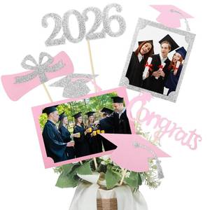 lot 12049 image: Qinyoung 2026 Graduation Decorations 30 Pcs Glittering Graduation Centerpiece for Tables Sticks Class of 2026 Grad Photo Centerpiece Party Decoration for Table Toppers(Pink White)