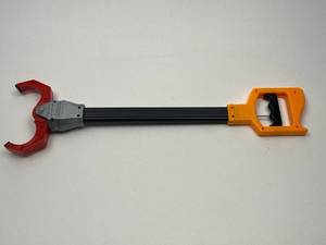 lot 206 image: Toy Grabber Claw Tool with Orange Handle