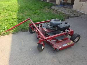 lot 21 image: Swisher 60-Inch Tow-Behind Finish Cut Mower with Briggs & Stratton 14.5 HP Engine