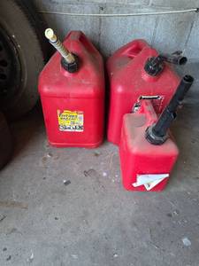 lot 28 image: Set of 3 Red Plastic Gas Cans with Spouts