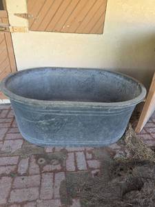 lot 36 image: Large Oval Heavy-Duty Plastic Stock Tank 52in x  37in x 21in
