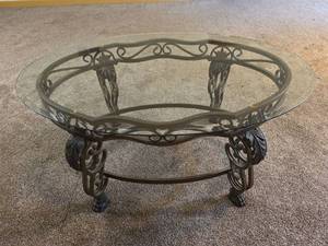 lot 108 image: Oval Beveled Glass Top Coffee Table with Ornate Iron Base (matches lots 105, 106, 107)