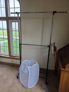 lot 117 image: Double Bar Adjustable Rolling Clothes Rack with Pop-Up Mesh Laundry Hamper