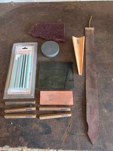lot 144 image: Knife Sharpening Kit with Norton India Oilstones, Silicon Carbide Stones, Leather Strop and Abrasive Pad