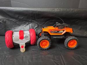 lot 380 image: Remote Control Rock Machine Monster Truck with Stunt Wheels and Really RAD Robot- No Remotes