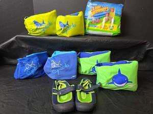 lot 396 image: Kids Swimming Bundle with Speedo Arm Bands Water Shoes and Little Swimmers