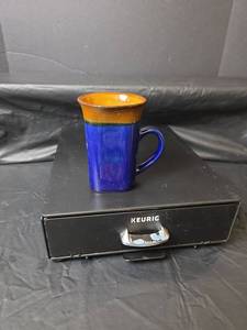 lot 407 image: Blue and Brown Glazed Ceramic Coffee Mug with Keurig Pod Holder